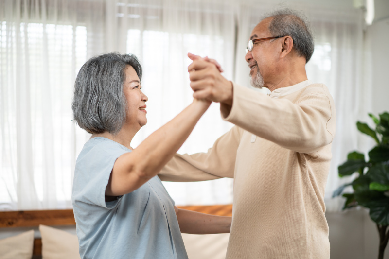 Asian senior couple dancing the waltz